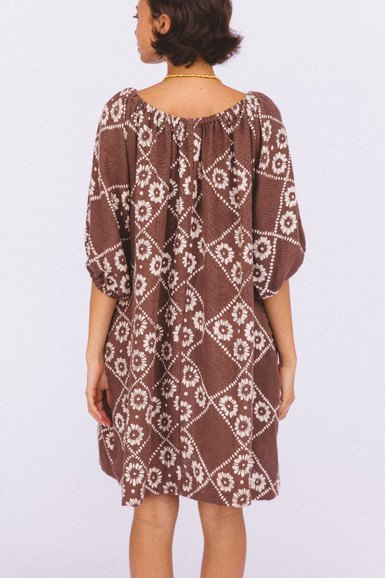 Dahlia Mini Dress Maple — back view studio shot, showing back neckline drape, full length silhouette, hand block print linen mini in maple brown geometric pattern, ethical artisan dress Jaipur | Daughters of India