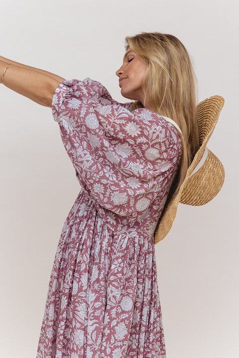 Daughters of India Kyra Midi Dress in Musk — studio back close-up with straw hat, billowed sleeves, gathered waist