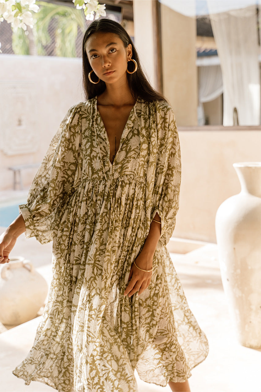 Daughters of India Kyra Midi Dress in Olive — close-up V-neckline in sunlit villa, billowed sleeves, olive floral print