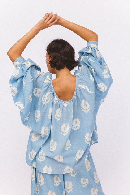 Ria Blouse Sky — outdoor scenic portrait, natural backdrop, sky blue cotton block print blouse, ethical slow fashion India | Daughters of India