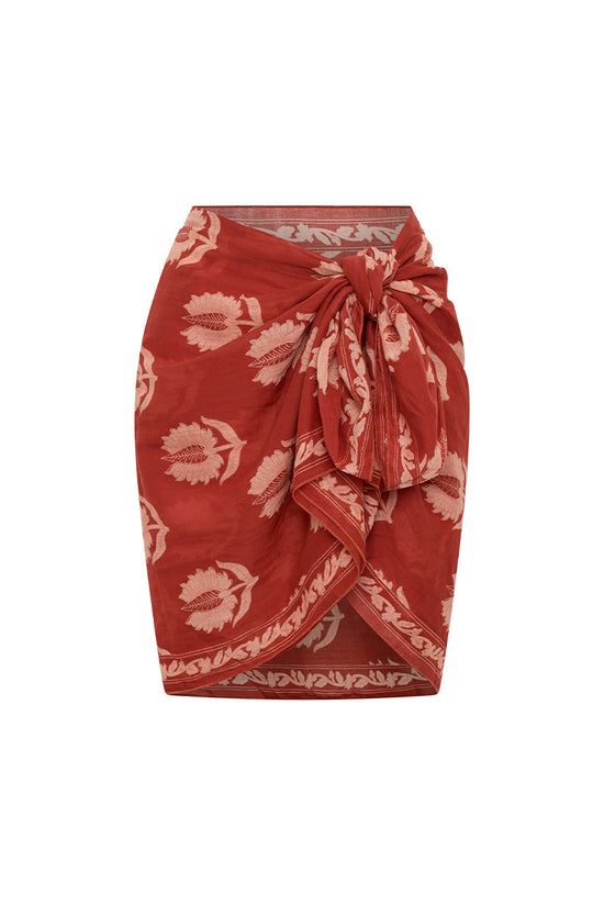 Ria Sarong Ruby Red — ghost mannequin front view tied at waist as mini wrap, ruby red hand block print cotton sarong with cream lotus motifs, white background | Daughters of India