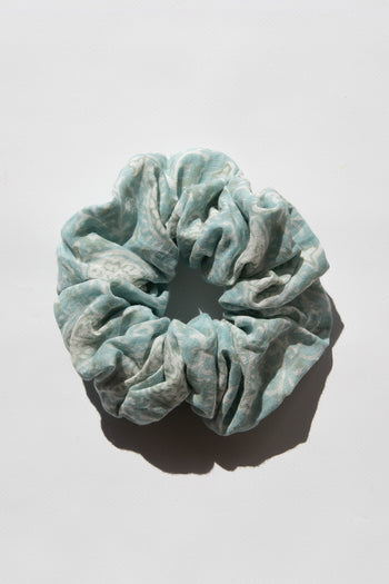 Daughters of India Upcycled Scrunchie in Sea Mist, a light blue-green hair scrunchie made from upcycled cotton fabric with subtle print
